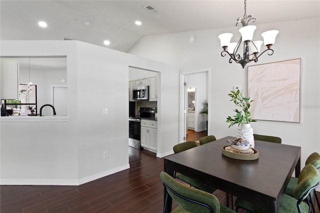 dining area with visible vents, baseboards, an inviting chandelier, dark wood-style floors, and vaulted ceiling