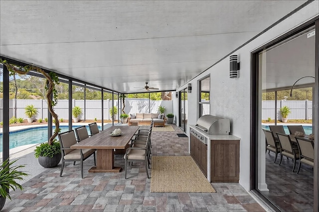 sunroom with outdoor lounge area, ceiling fan, outdoor dining area, and area for grilling