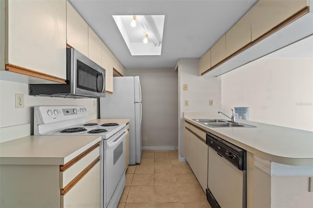 2745 N Poinciana Blvd Unit 65, Kissimmee, FL 34746 - kitchen with a sink, light countertops, cream cabinets, and white appliances