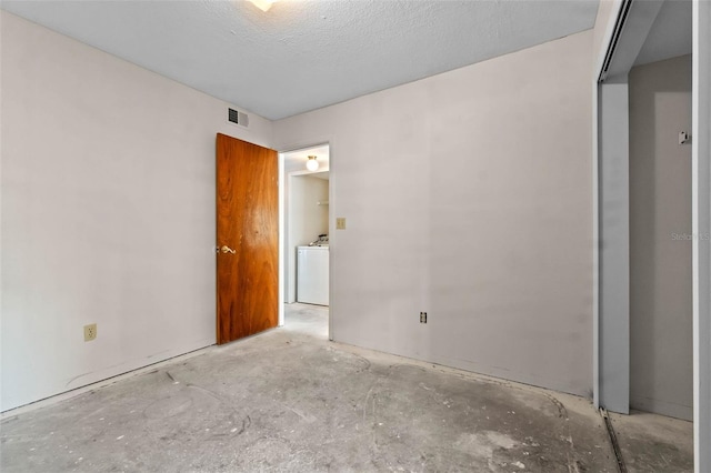 2745 N Poinciana Blvd Unit 65, Kissimmee, FL 34746 - empty room featuring concrete flooring, visible vents, and washer / dryer