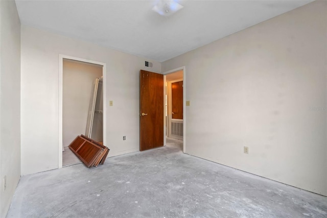 2745 N Poinciana Blvd Unit 65, Kissimmee, FL 34746 - unfurnished bedroom with visible vents and unfinished concrete flooring