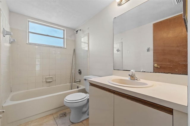 2745 N Poinciana Blvd Unit 65, Kissimmee, FL 34746 - bathroom with tile patterned floors, vanity, bathtub / shower combination, and toilet