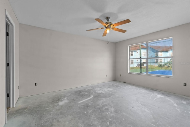 2745 N Poinciana Blvd Unit 65, Kissimmee, FL 34746 - empty room featuring ceiling fan and unfinished concrete flooring