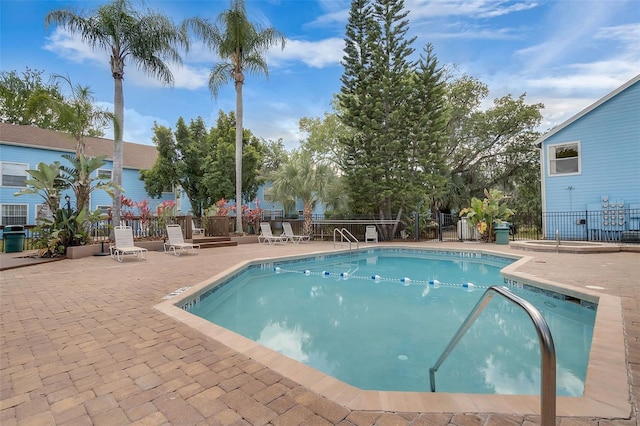 2745 N Poinciana Blvd Unit 65, Kissimmee, FL 34746 - community pool featuring a patio and fence