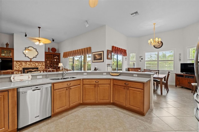 469 Sorrento Rd, Kissimmee, FL 34759 - kitchen with stainless steel dishwasher, light countertops, a sink, and a chandelier
