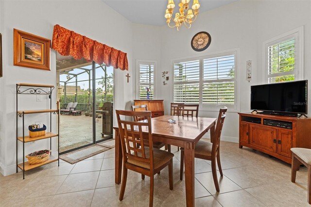 469 Sorrento Rd, Kissimmee, FL 34759 - dining space with light tile patterned floors, a notable chandelier, and baseboards