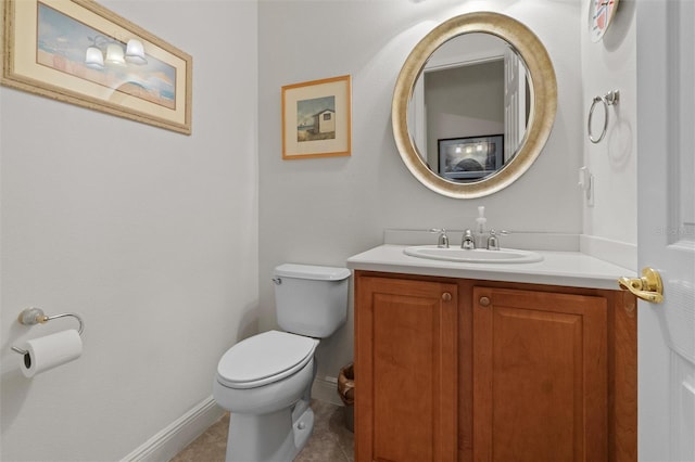 469 Sorrento Rd, Kissimmee, FL 34759 - half bathroom featuring tile patterned floors, toilet, vanity, and baseboards