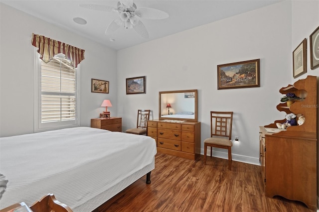 469 Sorrento Rd, Kissimmee, FL 34759 - bedroom with wood finished floors, baseboards, and a ceiling fan