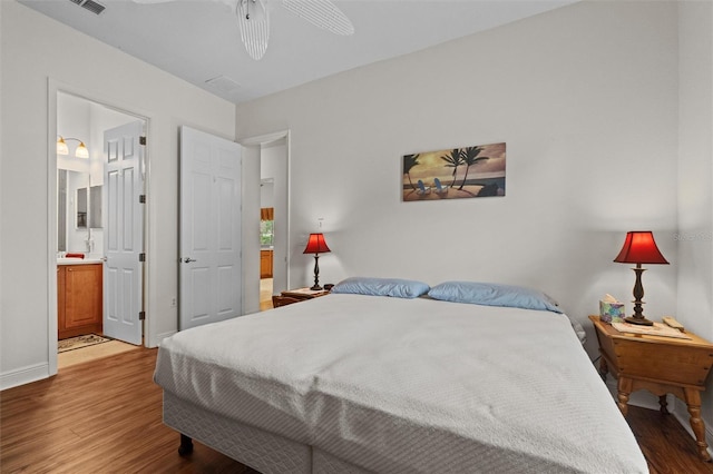 469 Sorrento Rd, Kissimmee, FL 34759 - bedroom with ceiling fan, connected bathroom, visible vents, wood finished floors, and baseboards