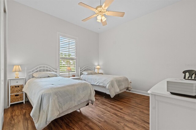 469 Sorrento Rd, Kissimmee, FL 34759 - bedroom with wood finished floors, baseboards, and a ceiling fan