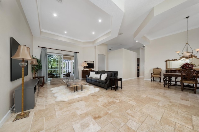 9509 Baycliff Ct, Orlando, FL 32836 - living area featuring a tray ceiling, stone tile flooring, a chandelier, ornamental molding, and recessed lighting