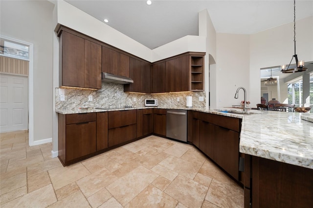 9509 Baycliff Ct, Orlando, FL 32836 - kitchen featuring stainless steel dishwasher, a sink, open shelves, under cabinet range hood, and decorative backsplash