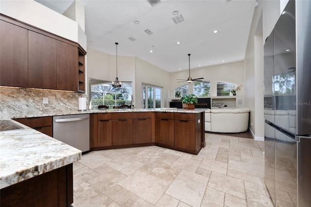 9509 Baycliff Ct, Orlando, FL 32836 - kitchen with appliances with stainless steel finishes, a peninsula, open shelves, open floor plan, and stone tile flooring