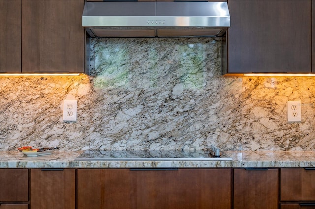 9509 Baycliff Ct, Orlando, FL 32836 - kitchen view of backsplash, range hood, and light stone counters