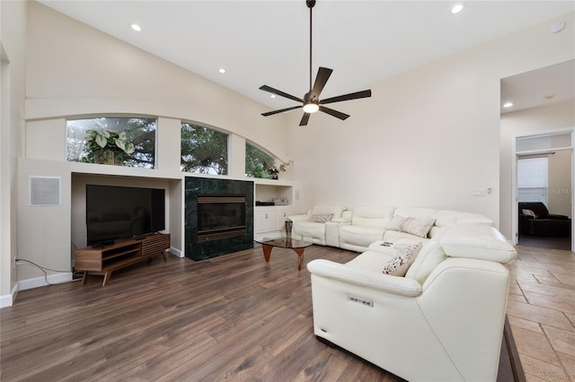 9509 Baycliff Ct, Orlando, FL 32836 - living area featuring a ceiling fan, a tiled fireplace, recessed lighting, high vaulted ceiling, and wood finished floors