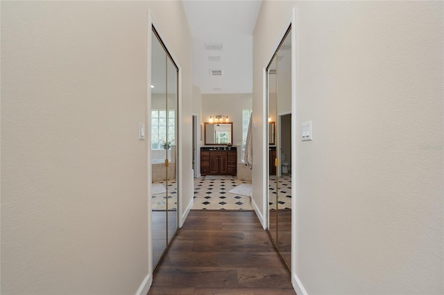 9509 Baycliff Ct, Orlando, FL 32836 - hallway with dark wood-style flooring and baseboards
