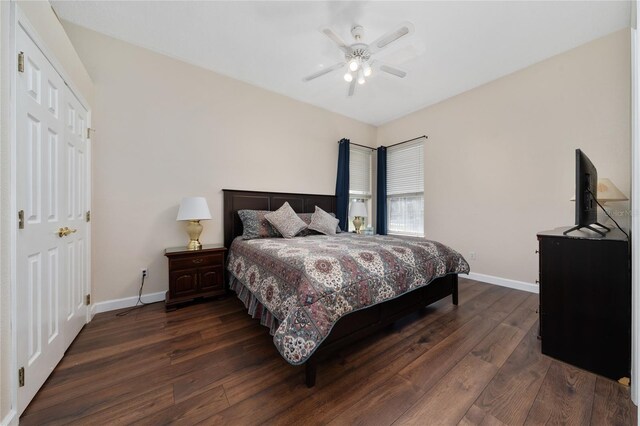 9509 Baycliff Ct, Orlando, FL 32836 - bedroom with dark wood-style floors, baseboards, and ceiling fan