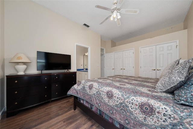 9509 Baycliff Ct, Orlando, FL 32836 - bedroom featuring wood finished floors, multiple closets, ensuite bath, and a ceiling fan