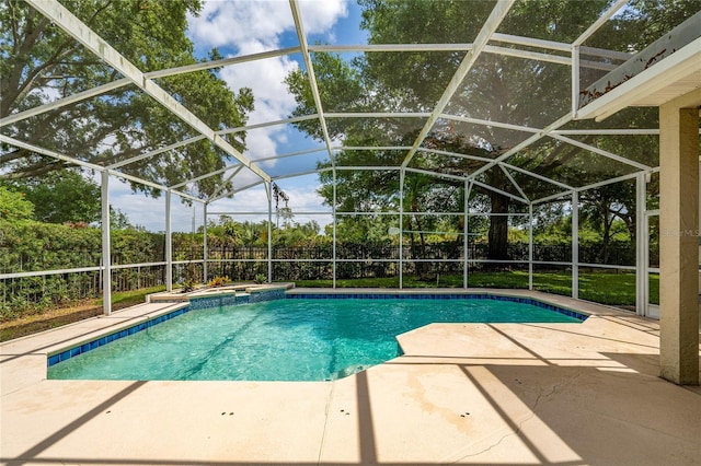 9509 Baycliff Ct, Orlando, FL 32836 - view of swimming pool featuring a patio, a fenced backyard, a pool with connected hot tub, and glass enclosure
