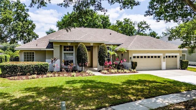 9509 Baycliff Ct, Orlando, FL 32836 - single story home with stucco siding, an attached garage, concrete driveway, a front yard, and a shingled roof