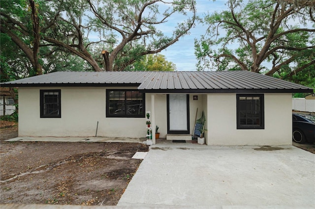 2804 Robinson Rd, Plant City, FL 33565 - ranch-style home with metal roof and stucco siding
