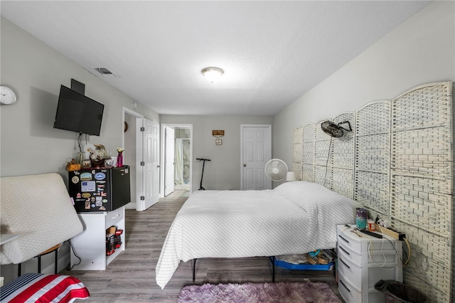 2804 Robinson Rd, Plant City, FL 33565 - bedroom featuring visible vents and wood finished floors