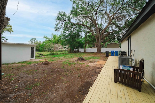 2804 Robinson Rd, Plant City, FL 33565 - view of yard featuring central AC unit, a wooden deck, and fence