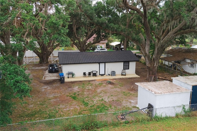 2804 Robinson Rd, Plant City, FL 33565 - exterior space featuring a fenced backyard, stucco siding, and metal roof