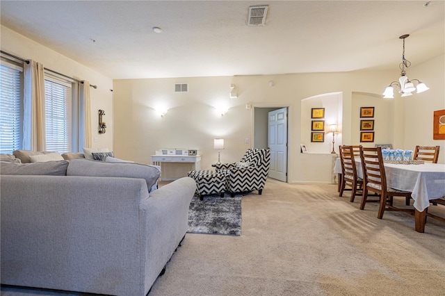 3301 Whitestone Cir Unit 203, Kissimmee, FL 34741 - living room with light colored carpet and a chandelier