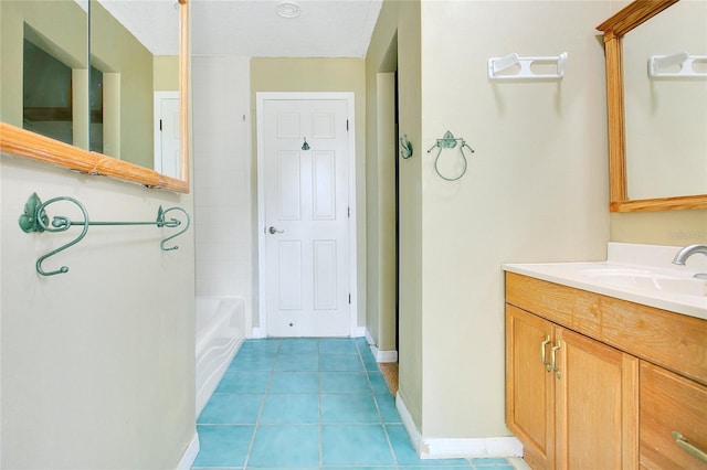 7938 Riffle Ln, Orlando, FL 32818 - full bath with tile patterned floors, vanity, a tub, and baseboards