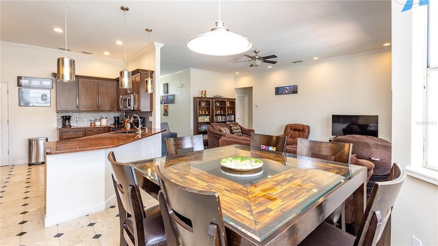 2734 Eagle Lake Dr, Orlando, FL 32837 - dining space with a ceiling fan, crown molding, and recessed lighting