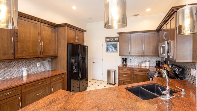 2734 Eagle Lake Dr, Orlando, FL 32837 - kitchen with decorative backsplash, appliances with stainless steel finishes, dark stone countertops, and a sink