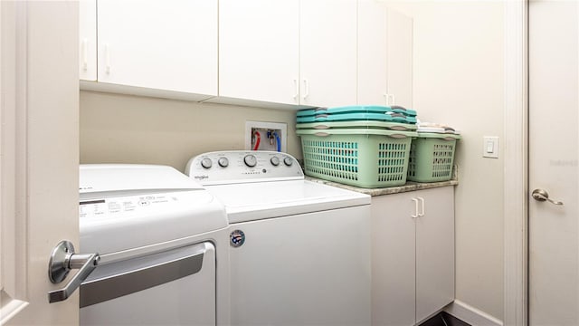 2734 Eagle Lake Dr, Orlando, FL 32837 - clothes washing area with cabinet space and independent washer and dryer