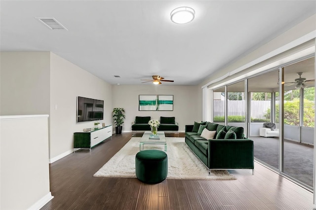 14010 102nd Ave, Largo, FL 33774 - living area with visible vents, baseboards, a ceiling fan, and dark wood-style floors