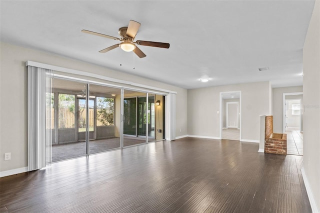 14010 102nd Ave, Largo, FL 33774 - unfurnished living room with wood finished floors, ceiling fan, and baseboards