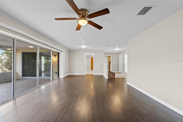 14010 102nd Ave, Largo, FL 33774 - unfurnished living room with wood finished floors, baseboards, a ceiling fan, and visible vents