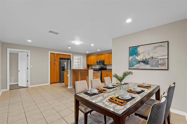 14010 102nd Ave, Largo, FL 33774 - dining space featuring recessed lighting, light tile patterned floors, visible vents, and baseboards