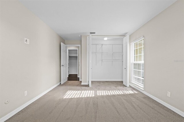 14010 102nd Ave, Largo, FL 33774 - unfurnished bedroom with baseboards, visible vents, and carpet floors