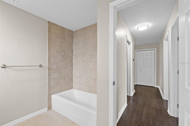 14010 102nd Ave, Largo, FL 33774 - hallway with baseboards and wood finished floors