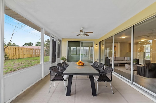 14010 102nd Ave, Largo, FL 33774 - sunroom / solarium with outdoor dining space, an outdoor living space, a ceiling fan, and a healthy amount of sunlight