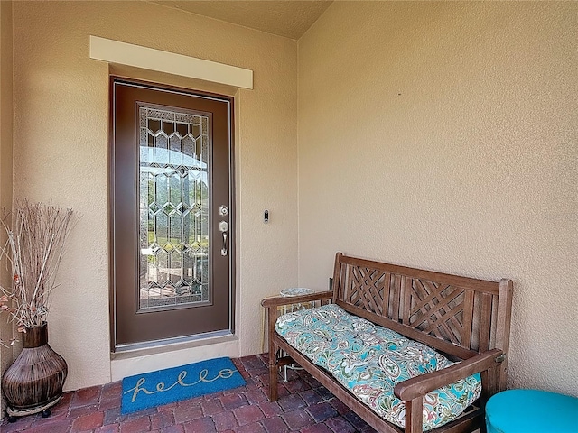 328 Vestrella Dr, Poinciana, FL 34759 - doorway to property featuring stucco siding