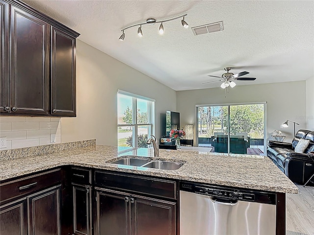 328 Vestrella Dr, Poinciana, FL 34759 - kitchen featuring visible vents, a sink, open floor plan, light wood-type flooring, and stainless steel dishwasher