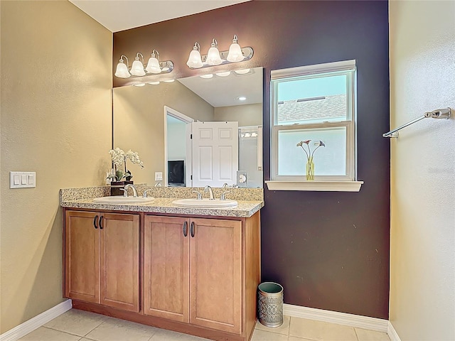 328 Vestrella Dr, Poinciana, FL 34759 - full bath with tile patterned floors, baseboards, and a sink
