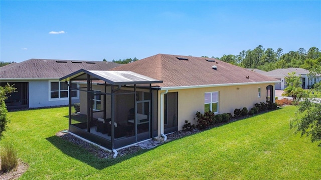 328 Vestrella Dr, Poinciana, FL 34759 - rear view of house featuring a yard, a sunroom, and stucco siding