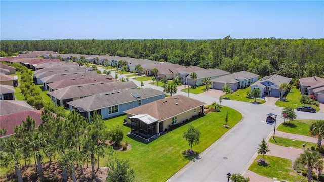 328 Vestrella Dr, Poinciana, FL 34759 - birds eye view of property featuring a residential view and a view of trees