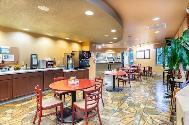 328 Vestrella Dr, Poinciana, FL 34759 - dining area featuring visible vents, recessed lighting, and stone finish floor