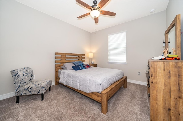 carpeted bedroom with baseboards and a ceiling fan