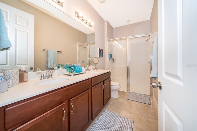 full bathroom with a shower stall, double vanity, and a sink