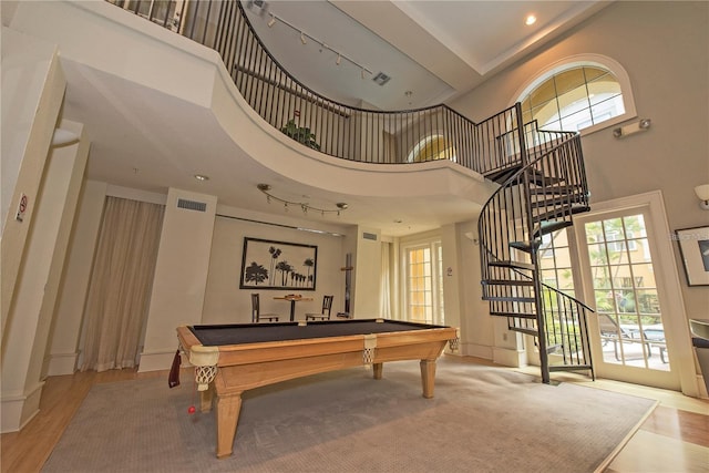 recreation room featuring visible vents, billiards, a wealth of natural light, and a towering ceiling