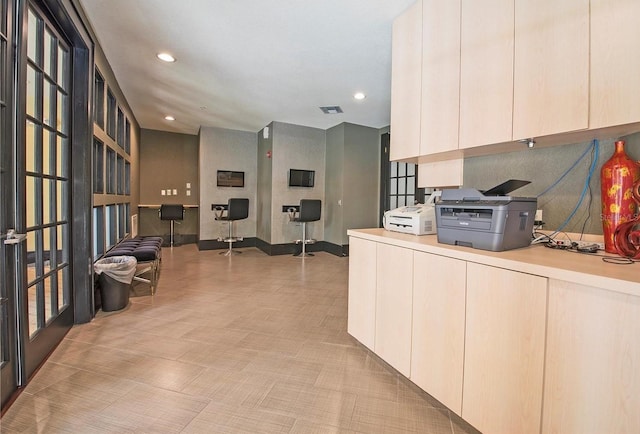 kitchen with light countertops, modern cabinets, visible vents, and recessed lighting